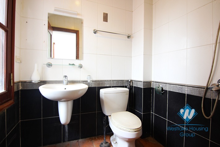 Unfurnished 4 bedrooms house with garage for rent in Xuan Dieu st, Tay Ho area.